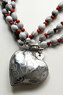Handmade tin heart necklace detail with